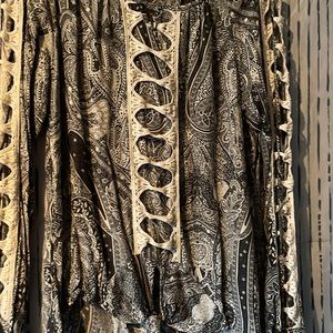 Black and white paisley dress shirt. Shows skin on arms.